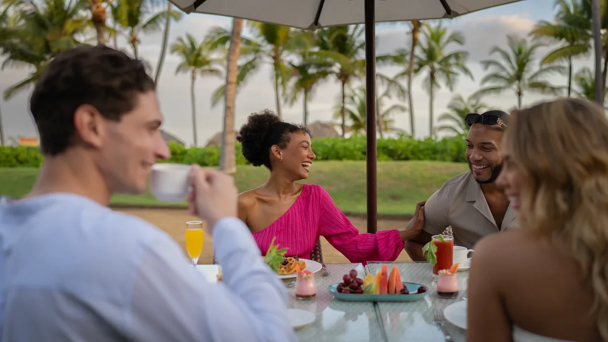 Adults dining outdoors at Breathless Punta Cana Resort & Spa