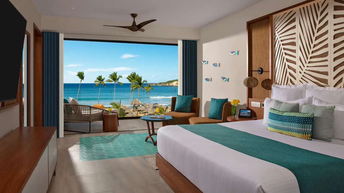 Oceanfront suite at Dreams Macao with a balcony view of Playa Macao
