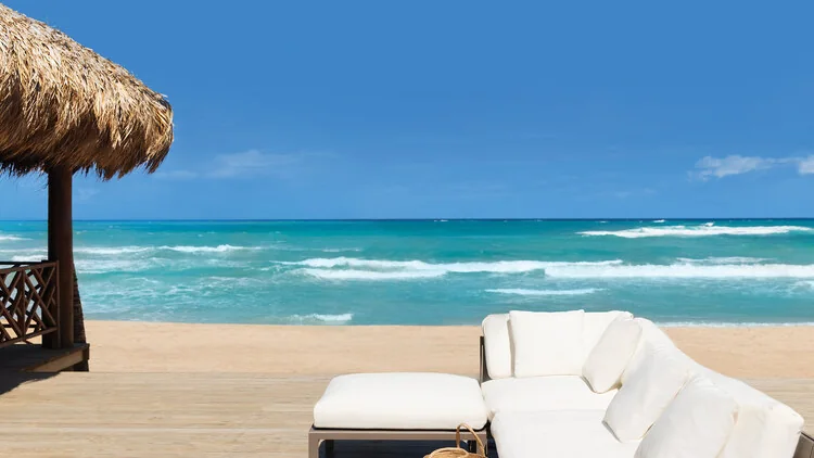 Las Olas beachfront bar lounge and seating beside the Caribbean Sea at Excellence Punta Cana