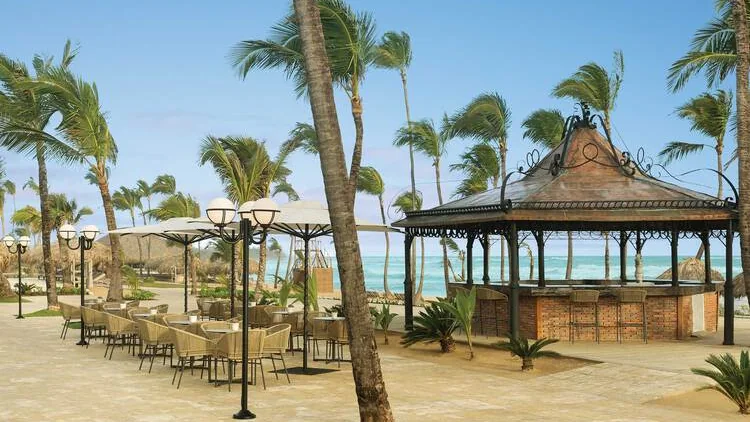 Prelude bar pavilion and outdoor seating in the resort square at Excellence Punta Cana