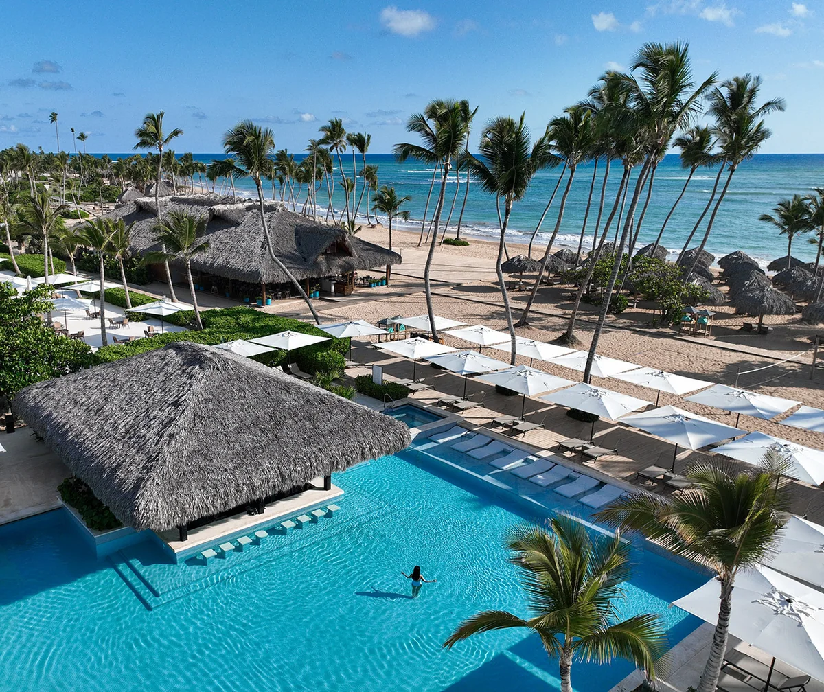 Finest Punta Cana pool, palms, beach and ocean viewed from above