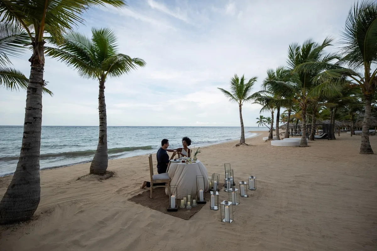 Couple dining on the beach at Live Aqua Punta Cana