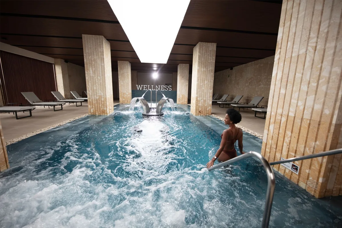 Guest in the hydrotherapy pool at Live Aqua Punta Cana