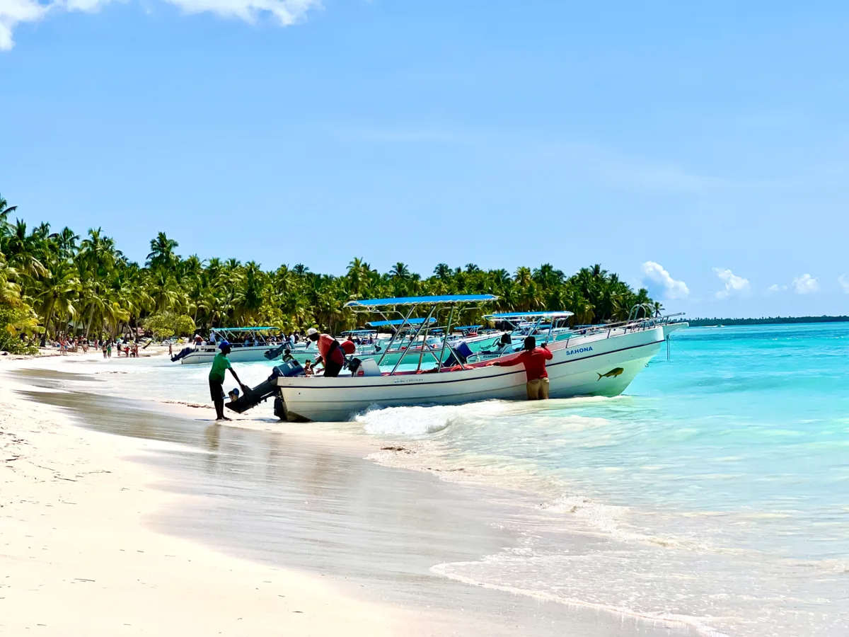 Boats on a Dominican Republic beach for regional arrival context
