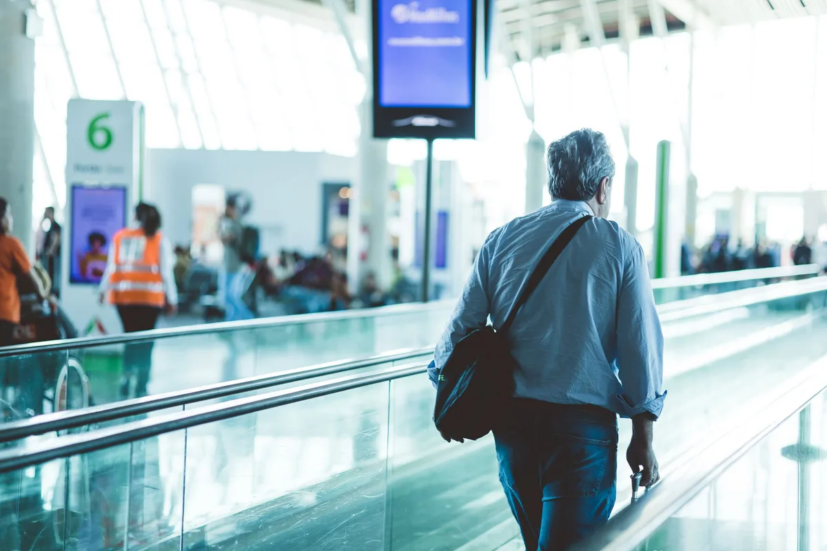 Traveller in a generic airport terminal for return-planning context