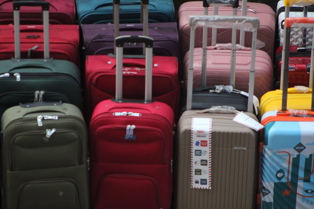 Collection of suitcases illustrating group luggage planning