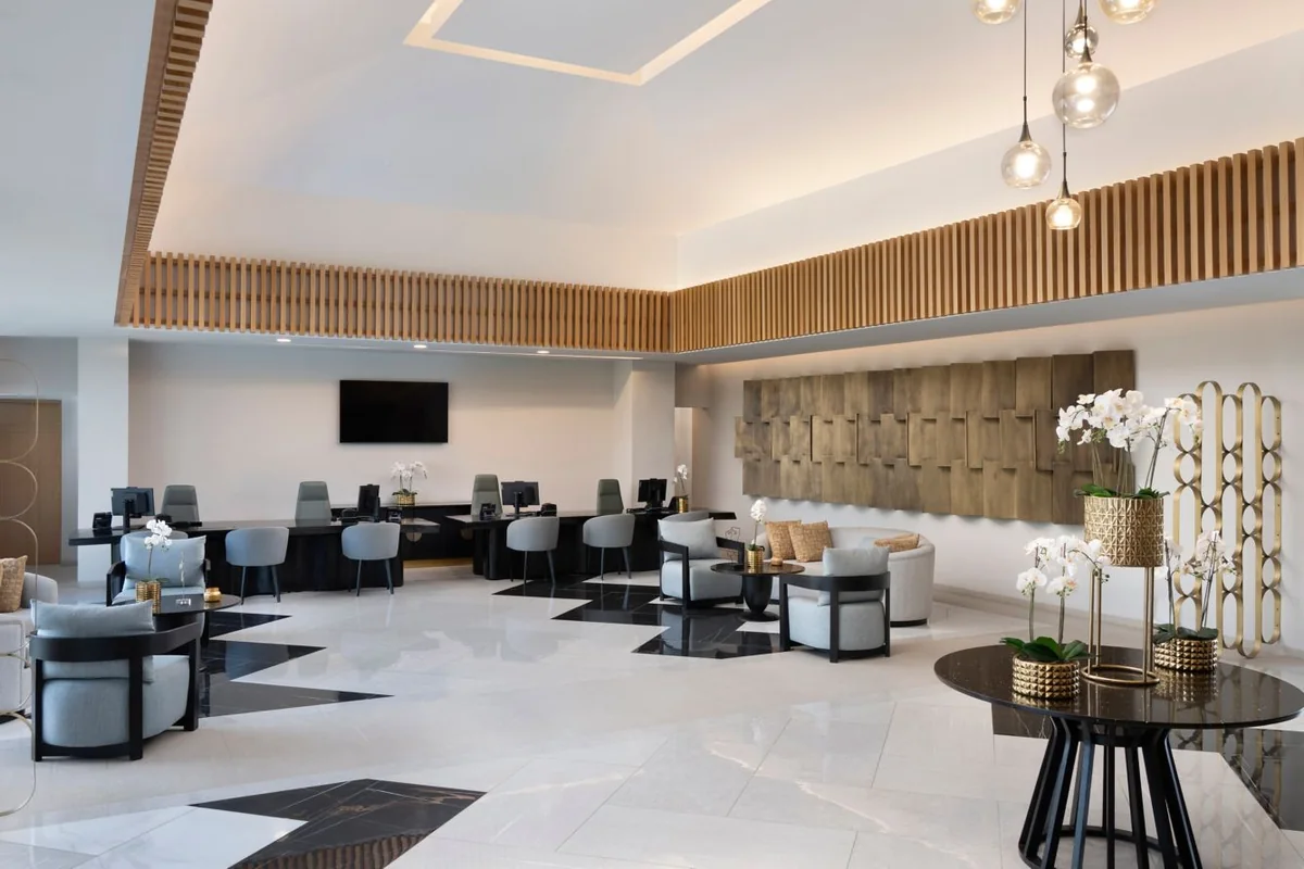 Grey seating and wood details in the Marriott Miches Beach lobby