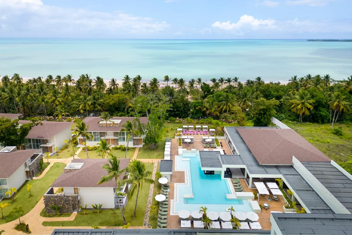 Pool and low-rise accommodation in the landscaped grounds of Marriott Miches Beach