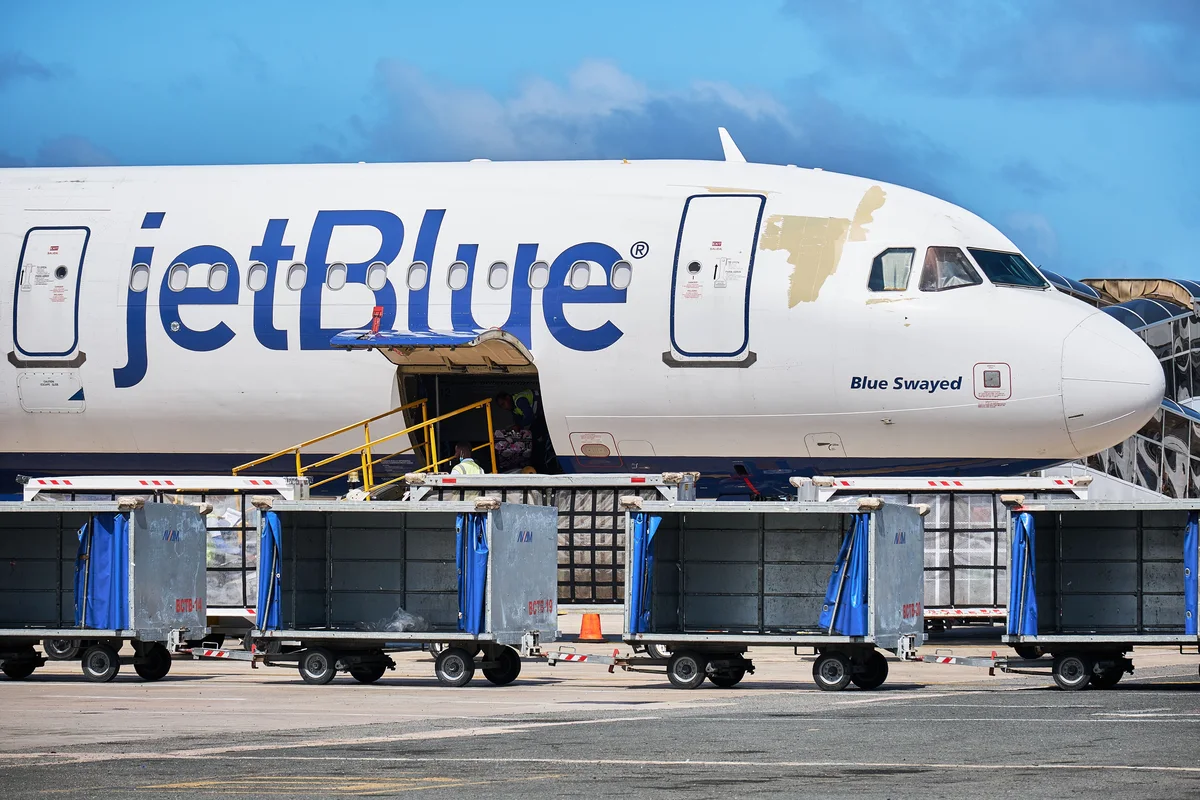 Airplane and luggage carts at Punta Cana Airport