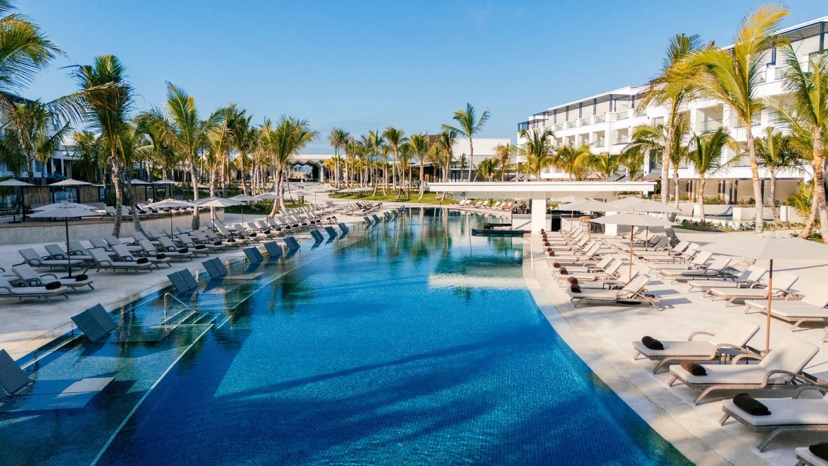 Pool and hotel buildings at Secrets Tides Punta Cana in Uvero Alto