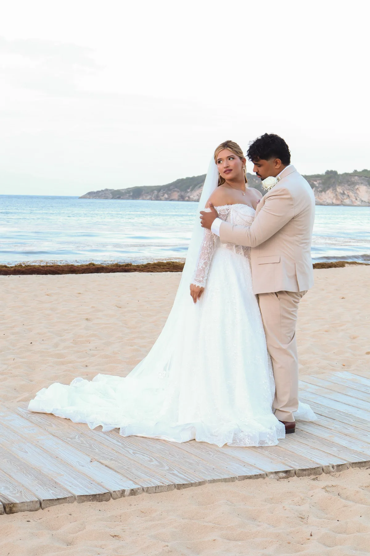 Couple embracing on a Punta Cana beach during a wedding