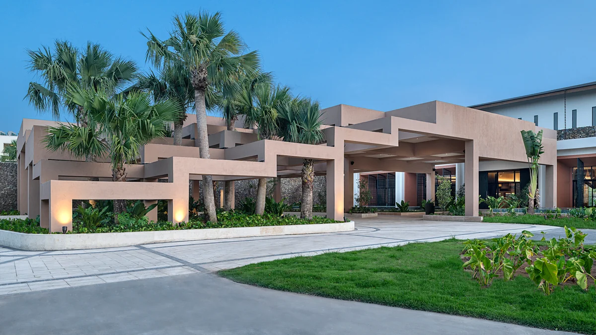 Landscaped main entrance and covered arrival area at Zemi Miches