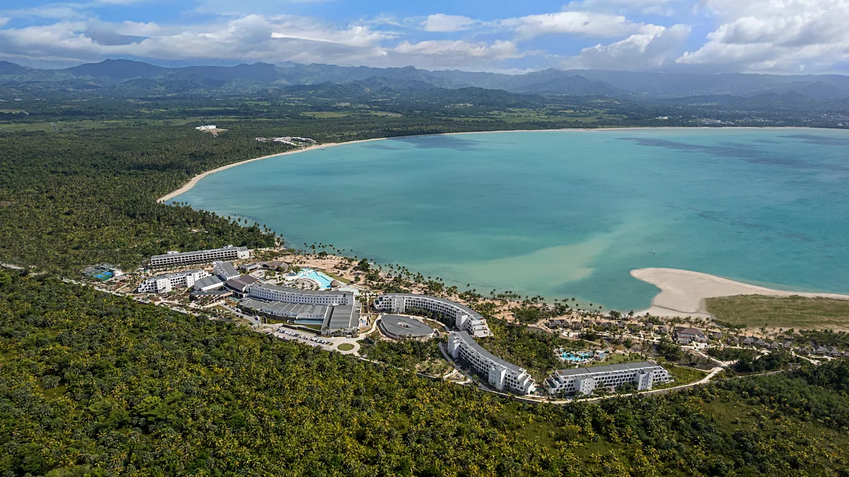 Zemi Miches resort buildings and pools beside the curved coastline