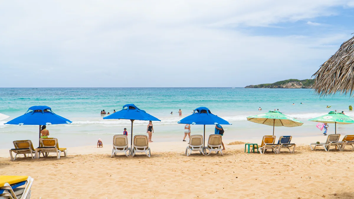Beach umbrellas and seating facing the sea at Macao Beach