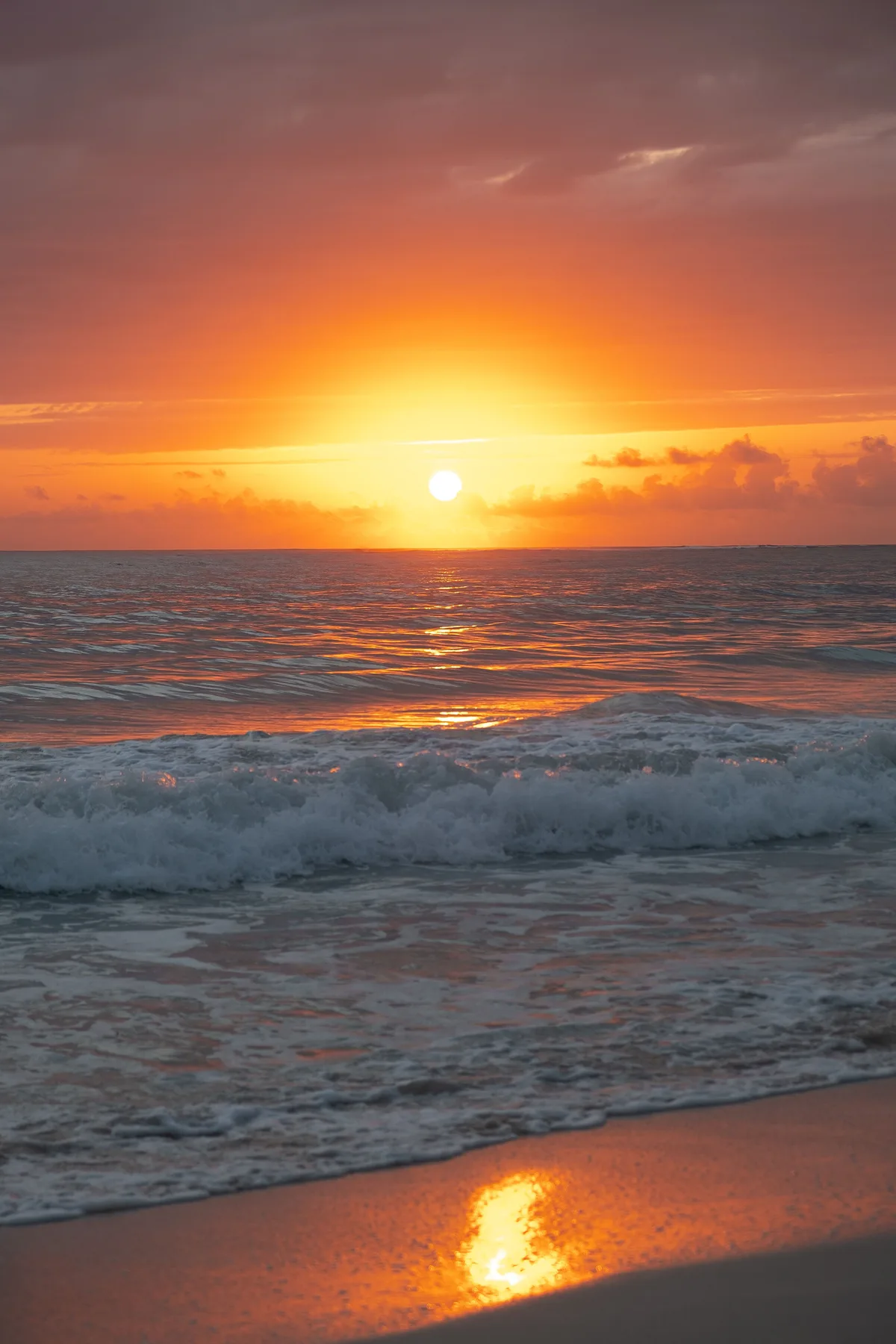 Sunset over waves at a Punta Cana beach