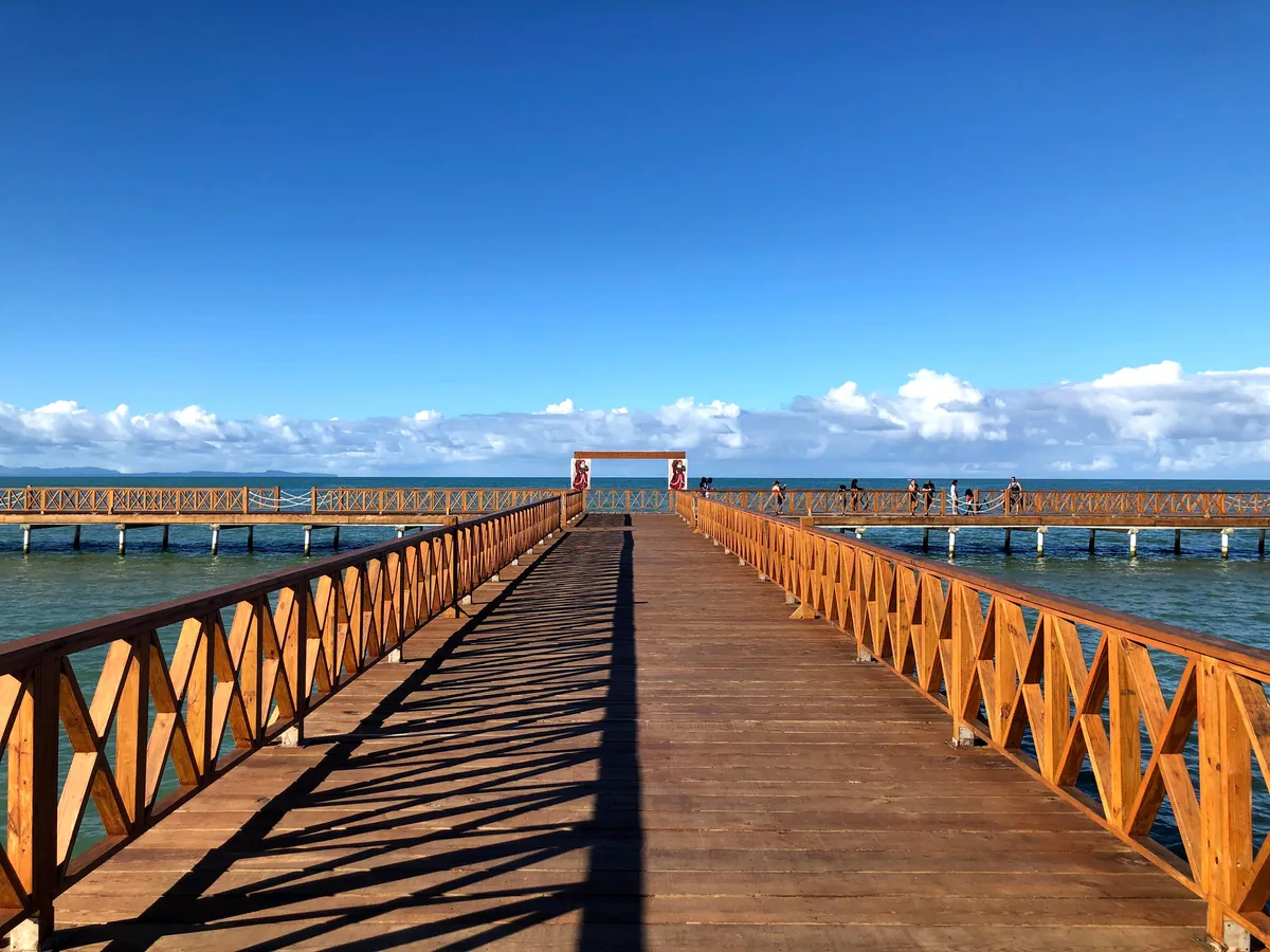 Wooden pier extending into the sea in Miches, Dominican Republic
