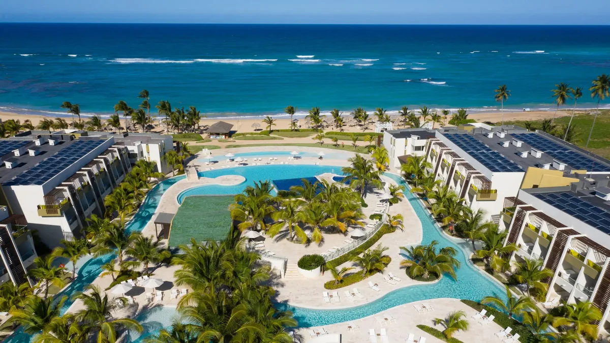 Aerial view of the pool and beach setting at Dreams Onyx Resort & Spa in Uvero Alto